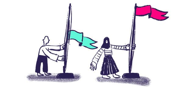 two people with flags